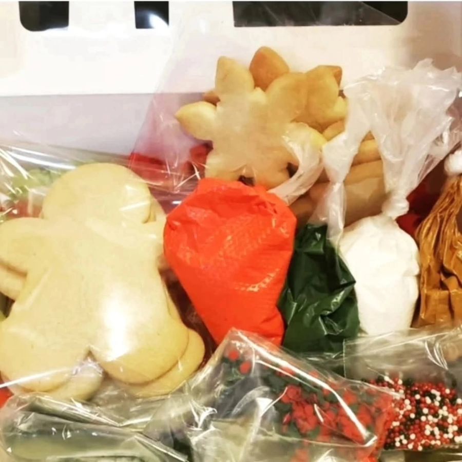 Cookie decorating kit with plain sugar cookies, bags of icing and sprinkles