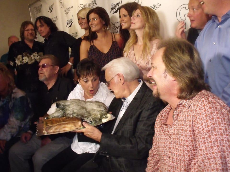 The possum cake being presented at George Jones' 80th birthday celebration