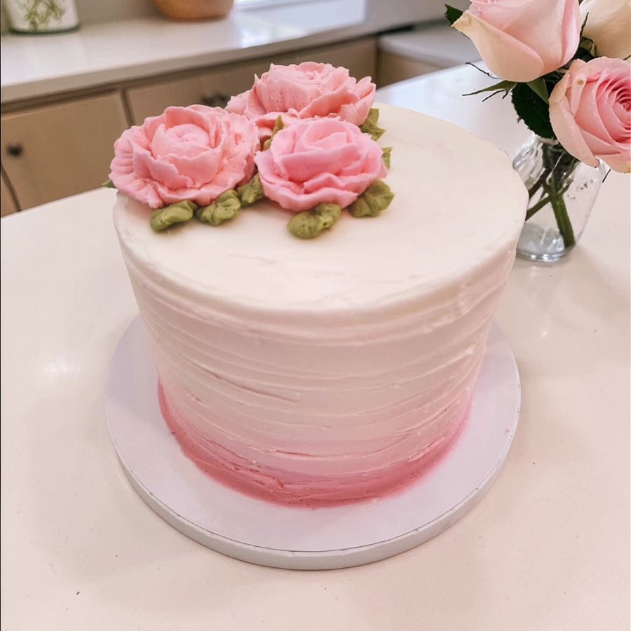 Pink ombre buttercream cake topped with piped peonies