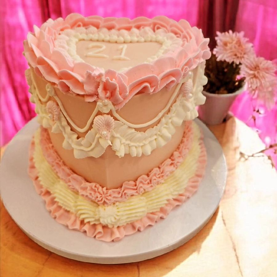 Pink vintage heart cake with ruffled piping for a 21st birthday